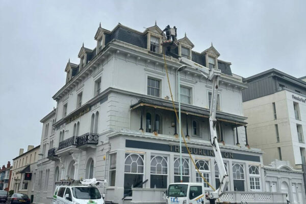Commercial gutter cleaning at the Burlington Hotel in Worthing and Dan on cherry picker