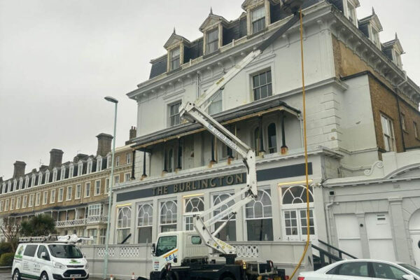 Commercial gutter clearing at the Burlington Hotel in Worthing with cherry picker